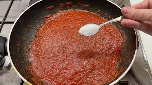 eliminate sourness from tomato sauce