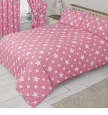 pink bedding set with a white star