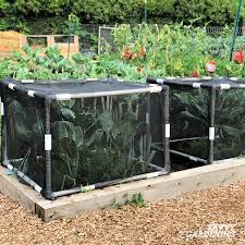 X 6' raised garden bed with hinged fencing and trellis. How To Use Garden Bed Covers To Protect Your Vegetable Garden