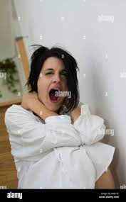A gaping woman - Gähnende Frau Stock Photo - Alamy