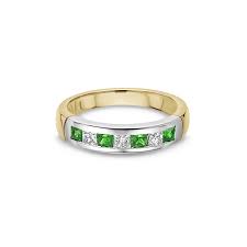 emerald channel set half eternity ring