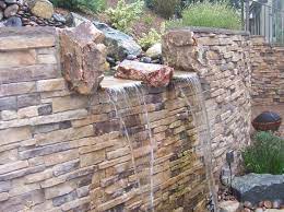 water feature on a retaining wall
