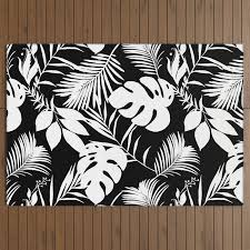 tropical monstera and palm leaves black