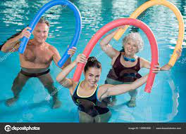 aqua aerobics with seniors stock photo
