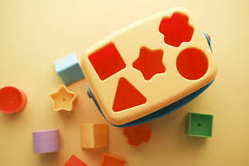 teach a baby to use a shape sorter toy