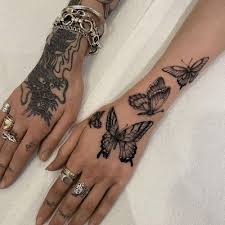 Big Butterfly going up hand tattoo