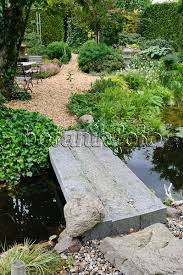 Image Garden Pond With Stone Bridge And