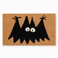 whimsical black bat doormat with glow