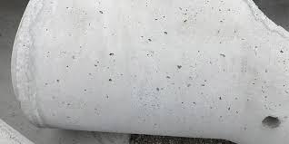 how to reduce bug holes in concrete