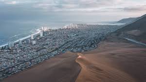 It is located on a rocky peninsula in the atacama desert, overlooking the pacific ocean. Iquique In Northern Chile Where The Desert Meets The Ocean