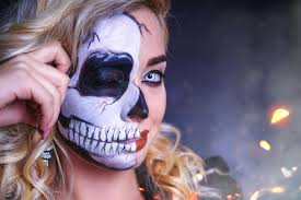 woman in halloween half skull makeup