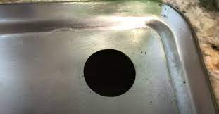to drill hole in stainless steel sink