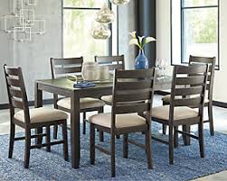 Furniture deals has been serving the kansas city area since 2004 with the lowest prices and best selection of furniture, mattresses & home decor. Rokane Dining Table And Chairs Set Of 7 Ashley Furniture Homestore