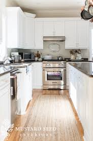 If you choose to paint the interiors, use an eggshell finish, which stands up well to the weight of heavy dishes. Painted Kitchen Cabinets Reveal Miss Mustard Seed