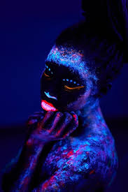 black woman with uv body art glowing