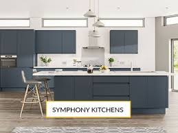 The kitchen features a smoked oak veneer island and top of the range appliances. Grey Kitchen Ideas At Your Turnbull Kitchens Showroom