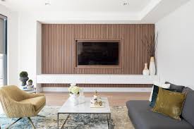 wood slat accent wall surrounds the tv