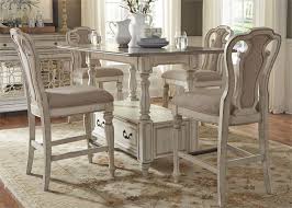 For storage, get a counter height dining room set with a rectangular centerpiece that has shelving, cubbies, or a wine rack. Magnolia Manor Counter Height Table 5 Piece Dining Set In Antique White Finish By Liberty Furniture 244 Dr 5gts