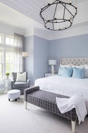75 gray floor bedroom with blue walls