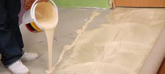 remove adhesive from a concrete floor