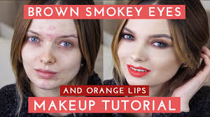 brown smokey eyes orange lips makeup