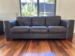 brown leather couch in melbourne region