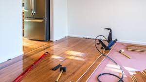can you install hardwood over carpet