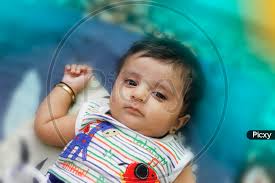 image of indian cute baby boy lying on