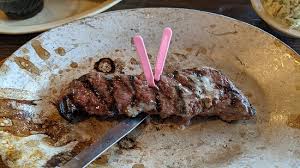 a thin slice of top sirloin steak at