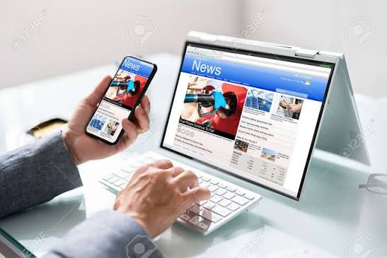 Watching News On Screen. Reading Newspaper Website On Laptop Stock Photo, Picture and Royalty Free Image. Image 189908983.