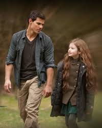 The first image show her half hidden behind her guarded parents. Jacob Renesmee Breaking Dawn Part 2 Still Twilight Saga Twilight Renesmee Twilight Series