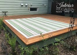 outdoor area rug on a wood deck