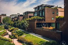 Modern Residential Buildings In The Public Green Area. Real Estate Houses In Milan, Italy. Stock Photo, Picture And Royalty Free Image. Image 145187919.