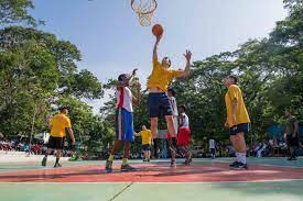 File:Sailors assigned to the Nimitz Carrier Strike Group play basketball  with students from the YMCA College of Physical Education in Chennai,  India, while participating in a community relations project during Malabar  2017.jpg -