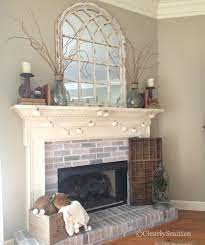 white arch mirror over fireplace