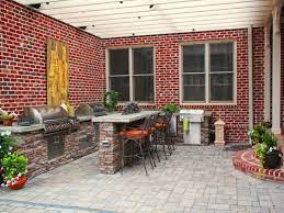 Contemporary Patio With Red Brick Walls