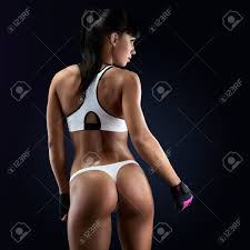 Rear View Of Fitness Female With Muscular Body Back Of A Fit