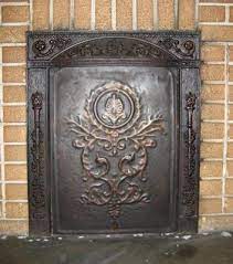 use old iron fireplace cover on wall