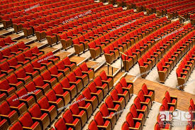 rows of red seats in the queen