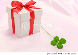 four leaf clover and gift box stock