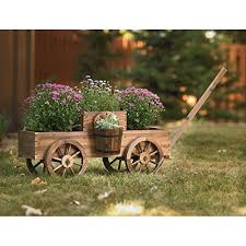 This weekend project is perfect for the herb gardener with limited space. Large Garden Planters Wooden Wagon Planter Rolling Outdoor Planters Wooden Wagon Wheels Outdoor Flower Pots Wood Garden Planters Buy Online In United Arab Emirates At Desertcart Ae Productid 34993396