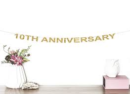 Well 10 year anniversary have the theme of tin or aluminium, the modern gift theme is white diamond and the flowers associated with the 10th anniversary is daffodils. 10th Anniversary Glitter Banner Cheers To 10 Years 10th Wedding Anniversary Birthday Anniversary Party Decor 10th Party Banner Buy Online In Botswana At Botswana Desertcart Com Productid 193599664