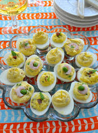 Awesome deviled egg baby carriages that can be served at a baby shower! Deviled Eggs 3 Ways Farmgirl Gourmet