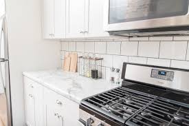 Watch to learn how to paint kitchen cabinets like a pro. Lowe S Stock Cabinets Review Diamond Now Arcadia White Shaker Cabinets Elizabeth Burns Design Raleigh Nc Interior Designer