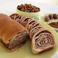 Many different versions of this rich bread, laced with rum syrup and drizzled with icing, are served at easter in polish households. Povitica Traditional Polish Sweet Christmas Bread Christmas Food Polish Desserts Christmas Cooking