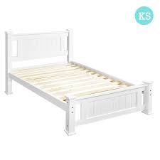 This stylish and functional platform storage bed comes with elegant tufted headboard, which metro series solid pine wood construction with partially engineer wood , caramel colour, drawers run on metal rails, brass coloured circular handles. King Single Size Pine Wooden Bed Frame In White White Wooden Bed White Bed Frame Wooden Bed