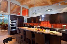 Beautiful bright orange subway tile makes a statement in this modern kitchen. Kitchen Backsplash Ideas A Splattering Of The Most Popular Colors