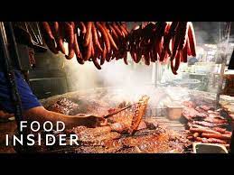 famous texas bbq cooks meat over a