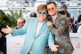 As the movie opens, elton is in an outrageous costume and he. Watch Rocketman Star Taron Egerton Sing With Elton John Ew Com