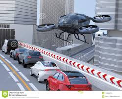 black passenger drone flying over cars